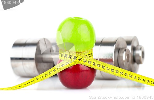 Image of Apples, measuring tape and dumbbells