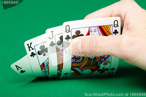 Image of man's hand with four cards