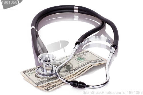 Image of stethoscope on dollars