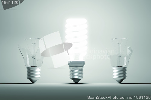 Image of Idea and mistake or failure: illuminated bulb among two broken o