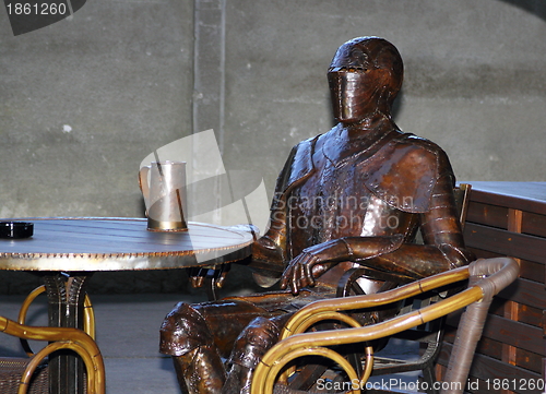 Image of armour having a beer