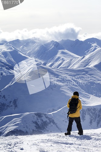 Image of Snowboarder on top of mountain