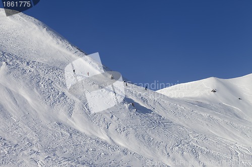 Image of Skiers and snowboarders on ski piste