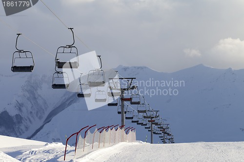 Image of Snow skiing piste and ropeway