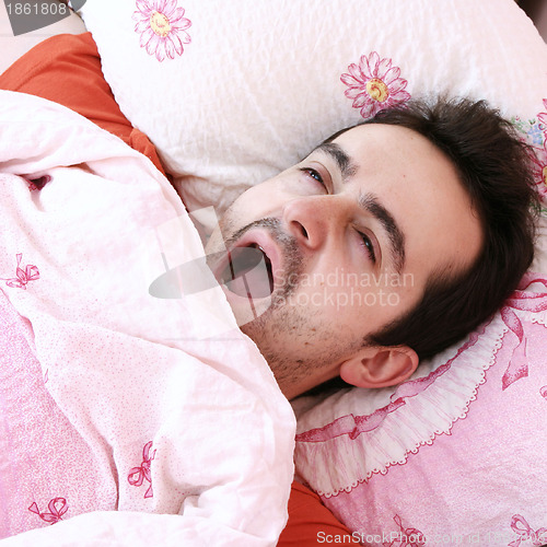 Image of Young man sleeping .