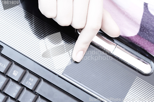 Image of Working at laptop .
