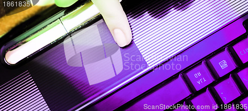 Image of Working at laptop .