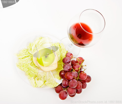 Image of green apple in a glass of wine