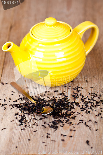 Image of teapot with spoon and tea