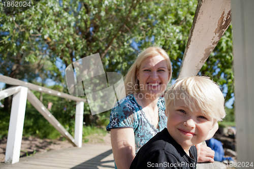 Image of Boy and mother outdoors