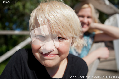 Image of Boy and mother outdoors