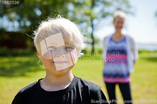 Image of Boy and mother outdoors