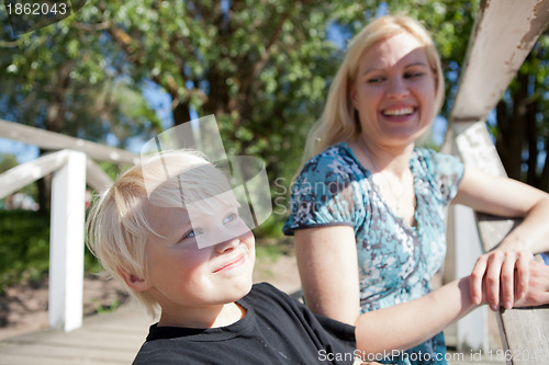 Image of Boy and mother outdoors