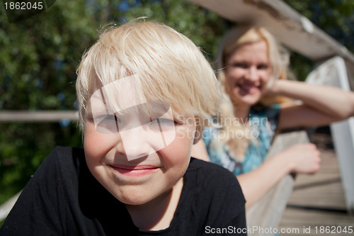 Image of Boy and mother outdoors