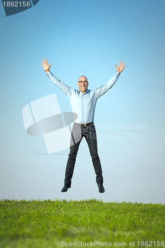 Image of happy jumping man