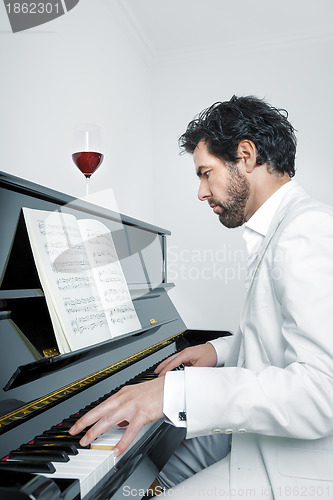 Image of man with piano