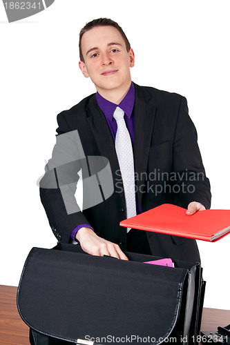 Image of Businessman presenting folder