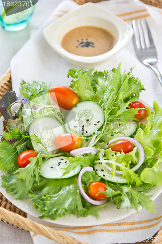 Image of Healthy salad with sesame dressing