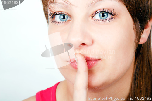 Image of girl with a finger to his lips