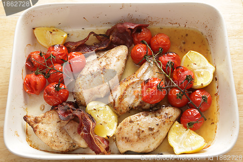 Image of Cooking grilled chicken and tomatoes