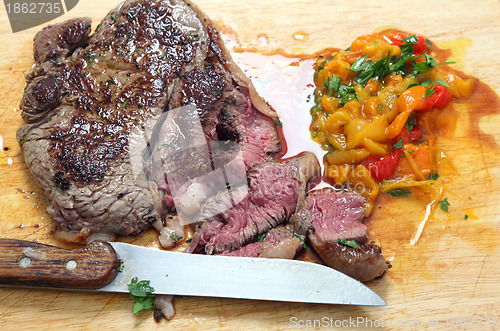 Image of Steak sliced on a board
