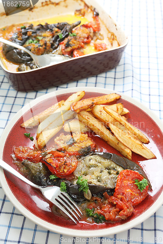 Image of Eggplant with onions and tomato vertical