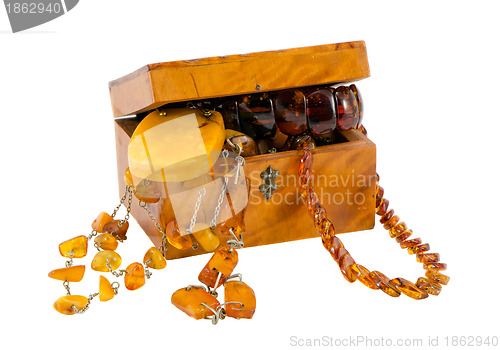 Image of Amber jewelry vintage wooden box isolate on white 