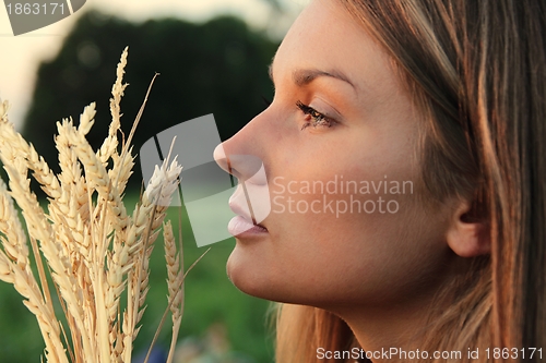 Image of Attractive Woman with wheat spikes