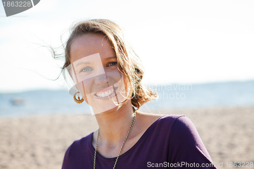 Image of Happy smiling woman at beach.