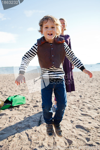 Image of Boy jumping at beach