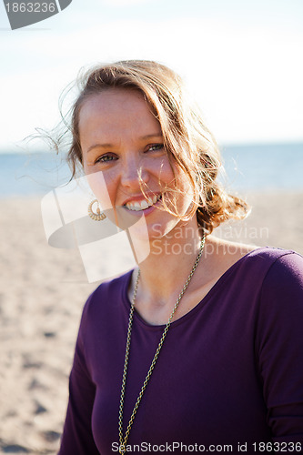 Image of Happy smiling woman at beach.