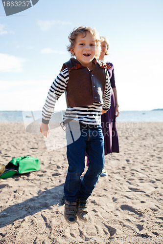 Image of Boy jumping at beach