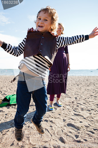 Image of Boy jumping at beach