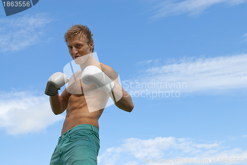 Image of Tough guy in boxing gloves