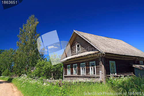 Image of rural house near sandy road