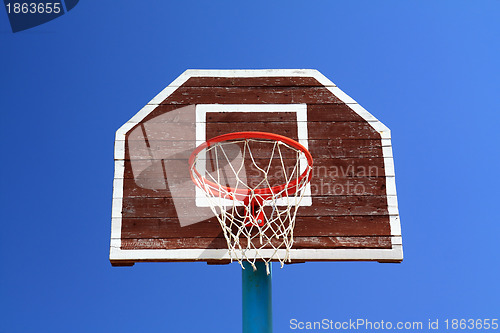 Image of basketball ring on blue background