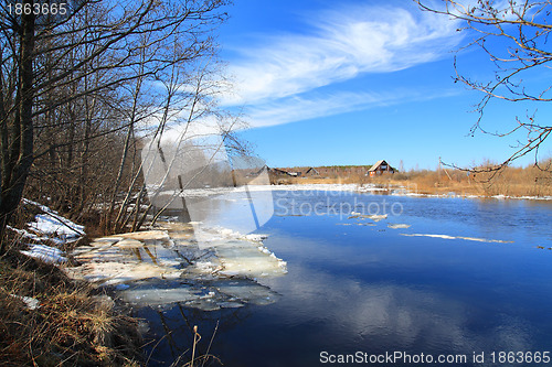 Image of rural house on coast autumn river