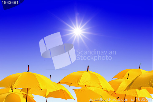 Image of yellow umbrellas on celestial background