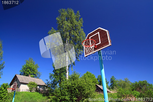 Image of basketball ring on blue background