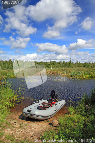 Image of rubber boat on small river