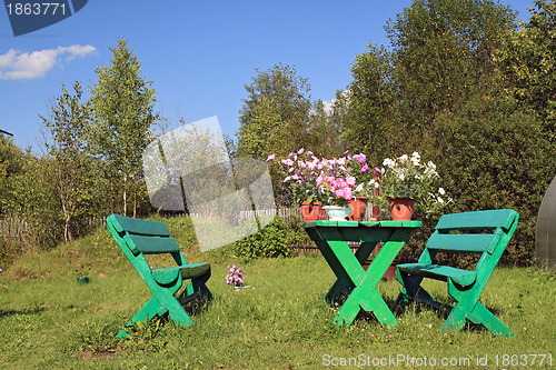 Image of summer flowerses on garden table