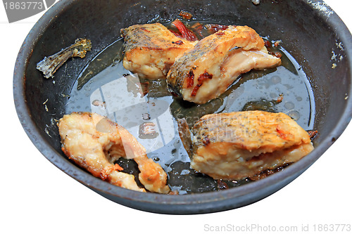 Image of roasted fish on black griddle