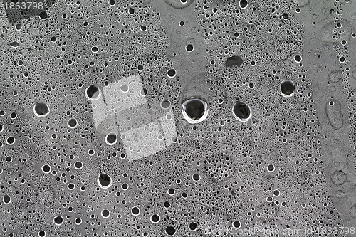 Image of rain dripped on gray cellophane