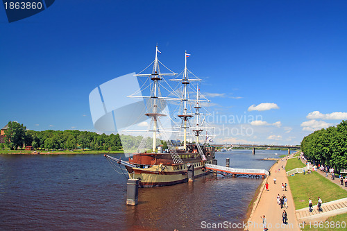 Image of big sailboat on town pier