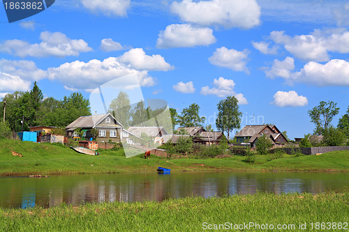 Image of aging village on river coast