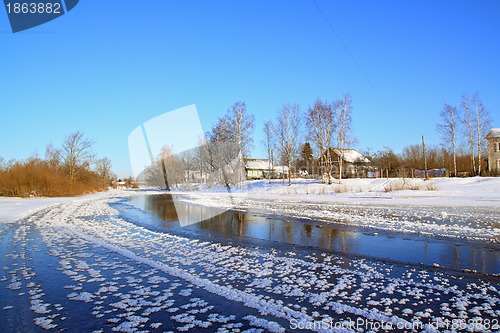 Image of winter village on coast river 