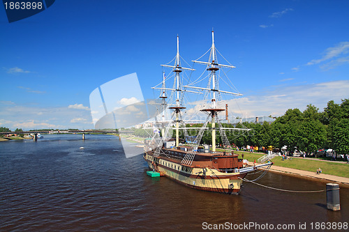 Image of big sailboat on town pier