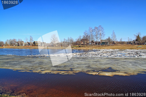 Image of village on coast autumn river