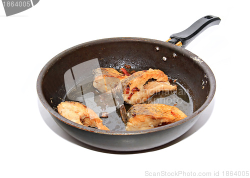 Image of roasted fish on black griddle
