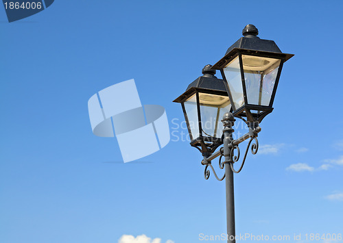 Image of town torch on blue background